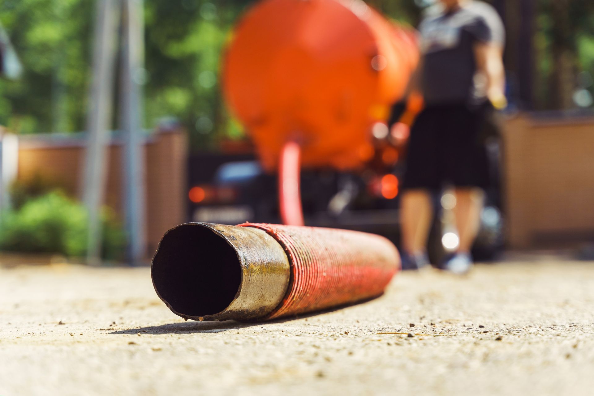 A red hose on the ground