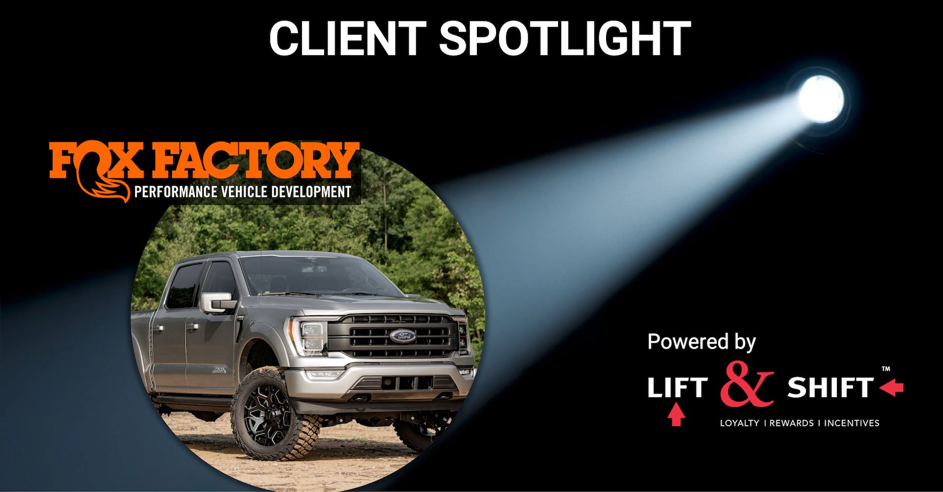 A fox factory truck is being spotlighted by a spotlight
