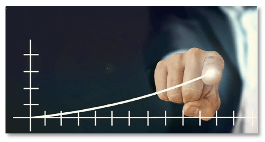 A person is pointing at a graph with a marker.