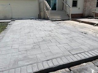 A close up of a brick floor with a circular pattern