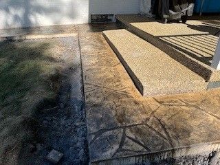 A large white house with a driveway leading to it
