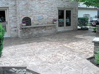 A close up of a black tile floor with a pattern on it.