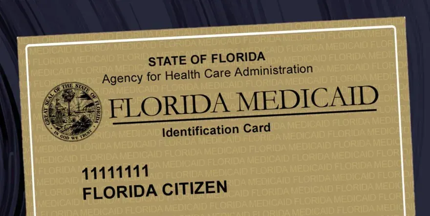 A gold-colored Florida Medicaid identification card with the name 
