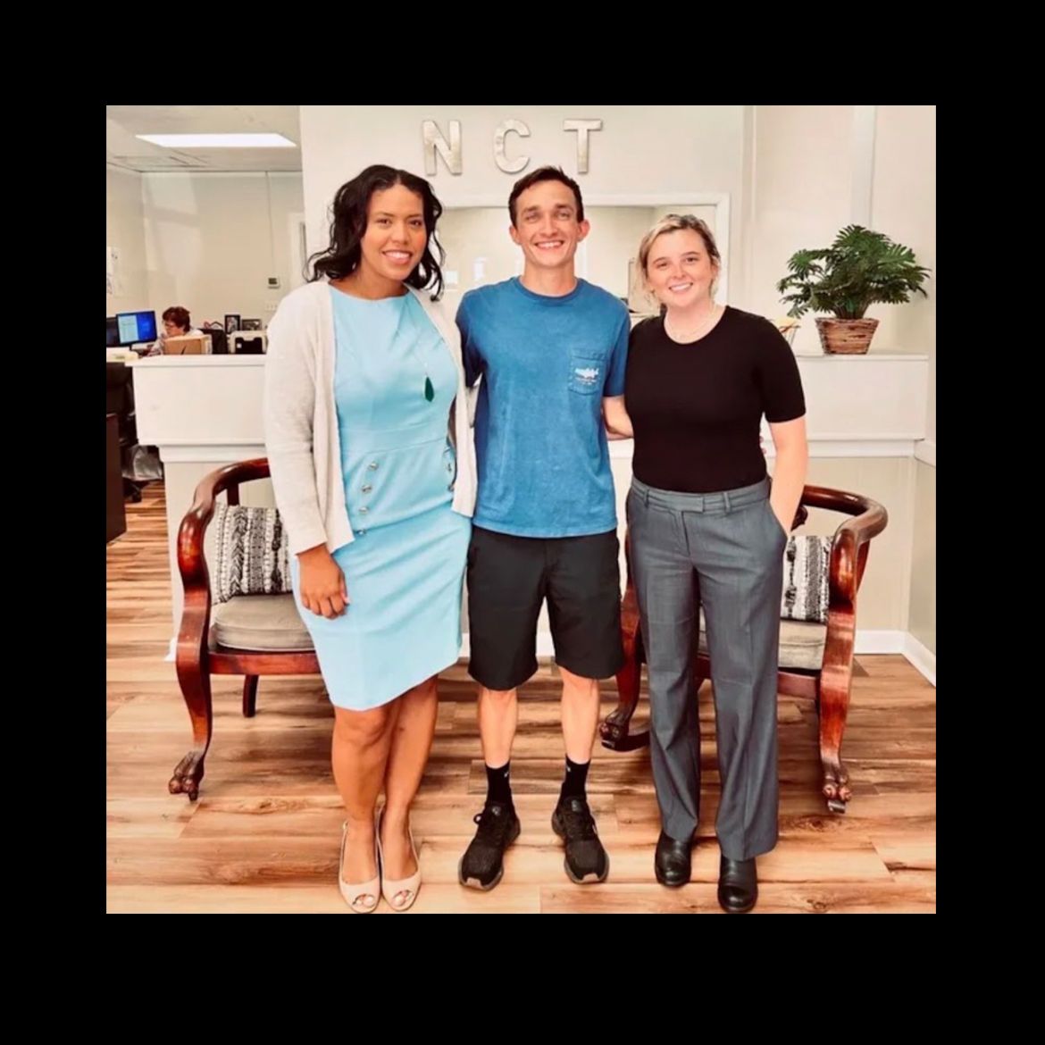 A living room filled with furniture and a fireplace.
