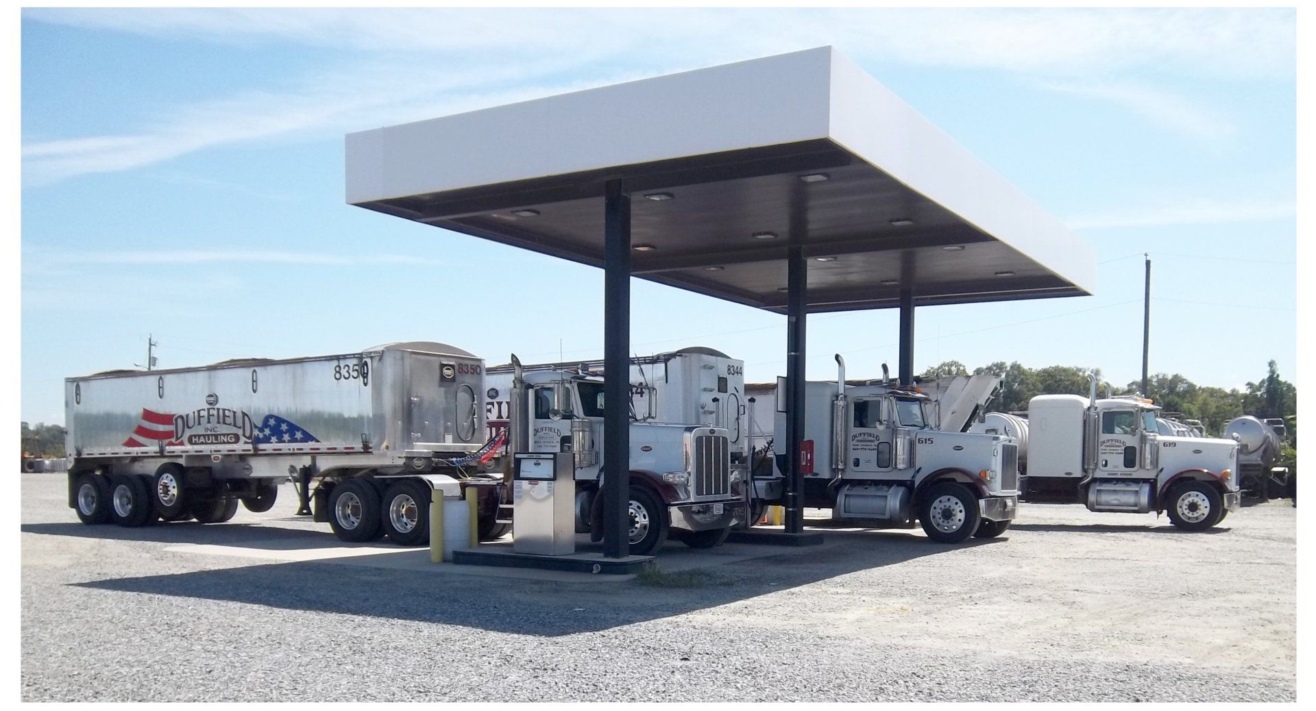 Truck On Highway At Golden Sunset — King George, VA — Duffield Hauling Inc.