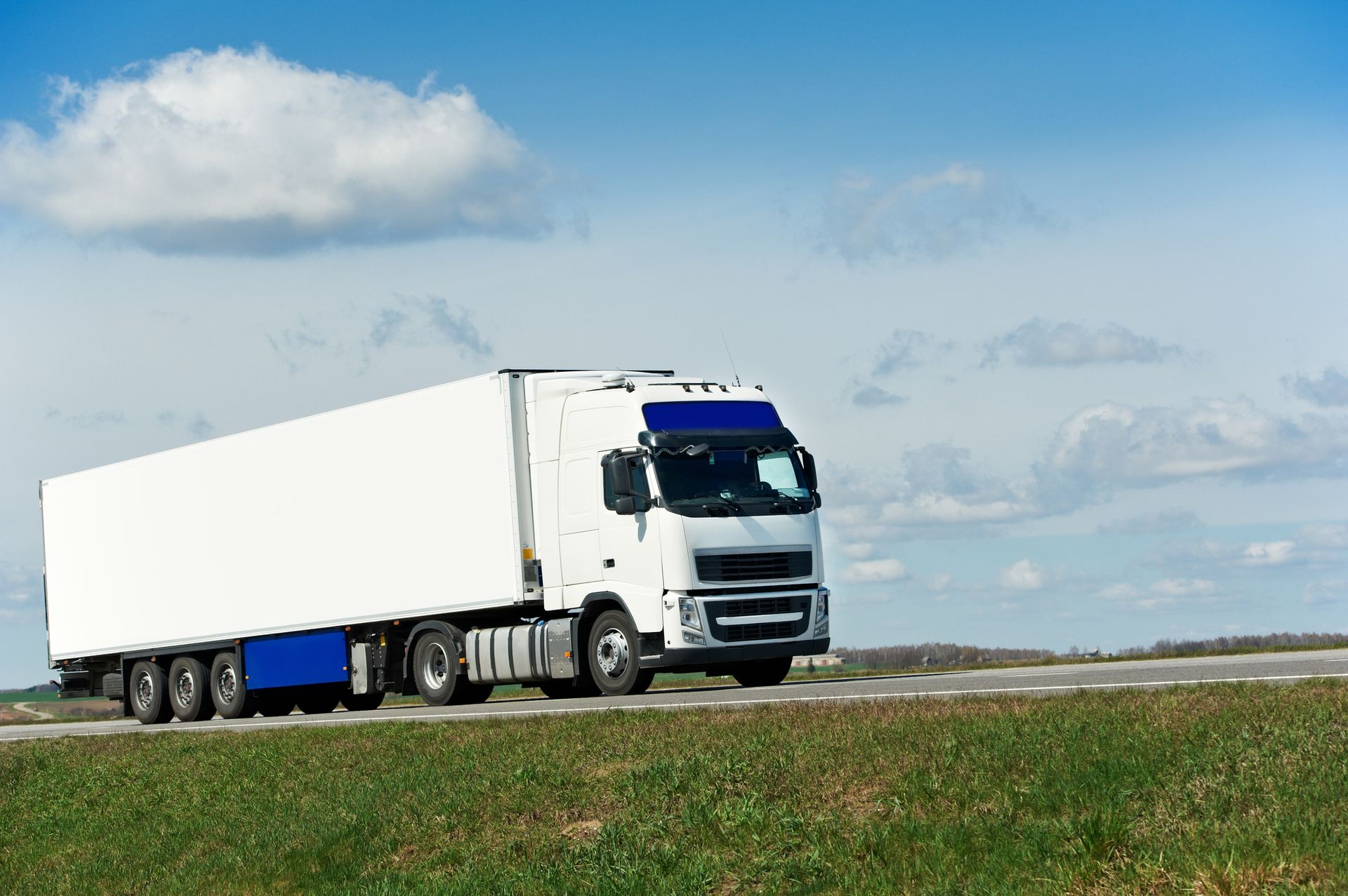 A Duffield Hauling, Inc. truck transporting a heavy load through Richmond, VA, showing our reliable 