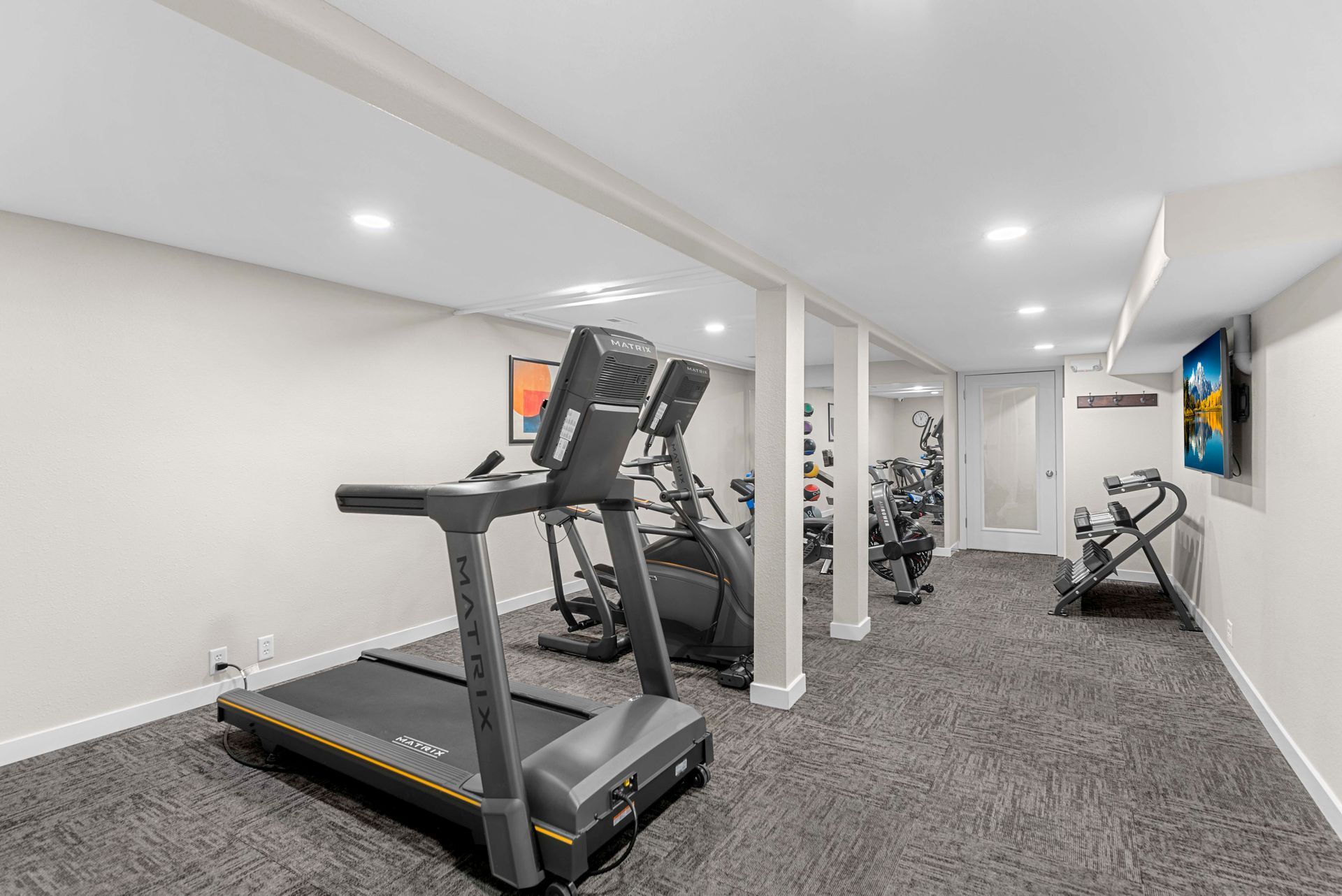 There is a treadmill in the middle of the room.