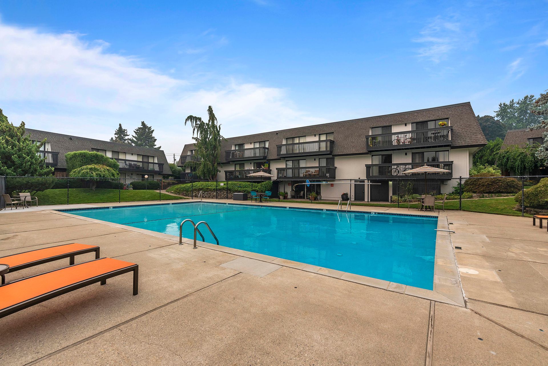 A large swimming pool in front of a building