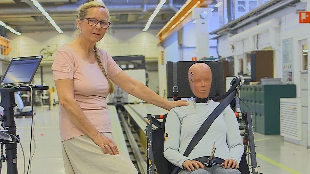 Photo of Dr Astrid Linder with the female crash dummy she has designed