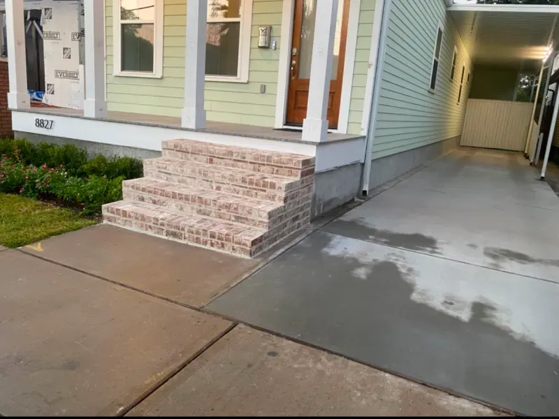 A house with brick steps leading up to the front door