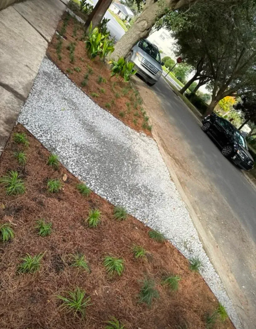 A car is parked on the side of the road next to a sidewalk.