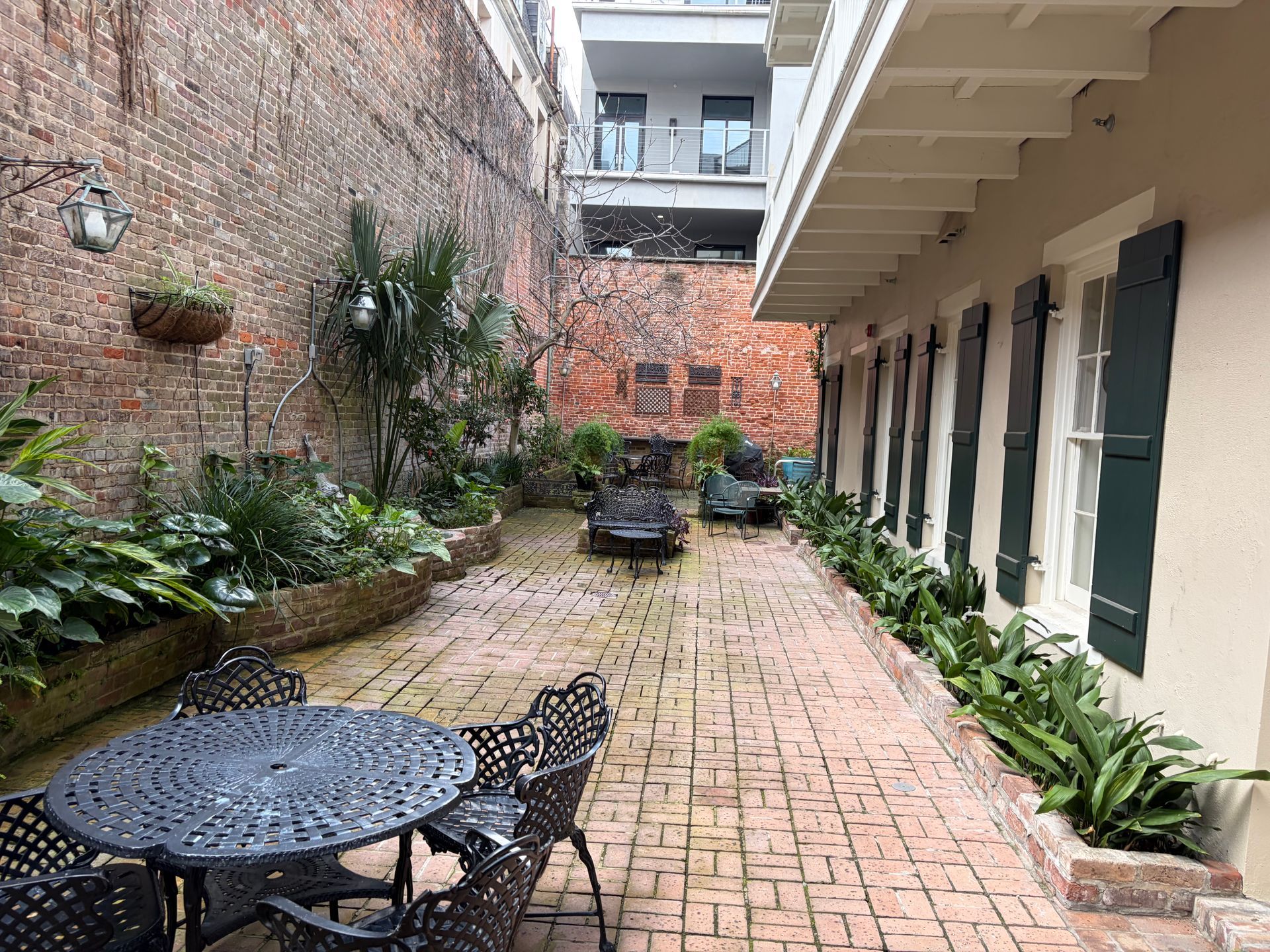 There is a fountain in the middle of the garden.