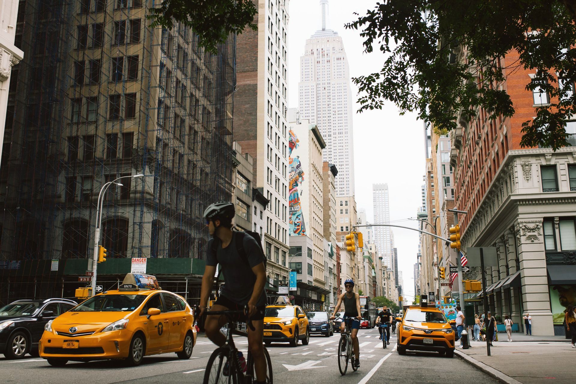 NYC Fifth Ave. with traffic and bicycle riders