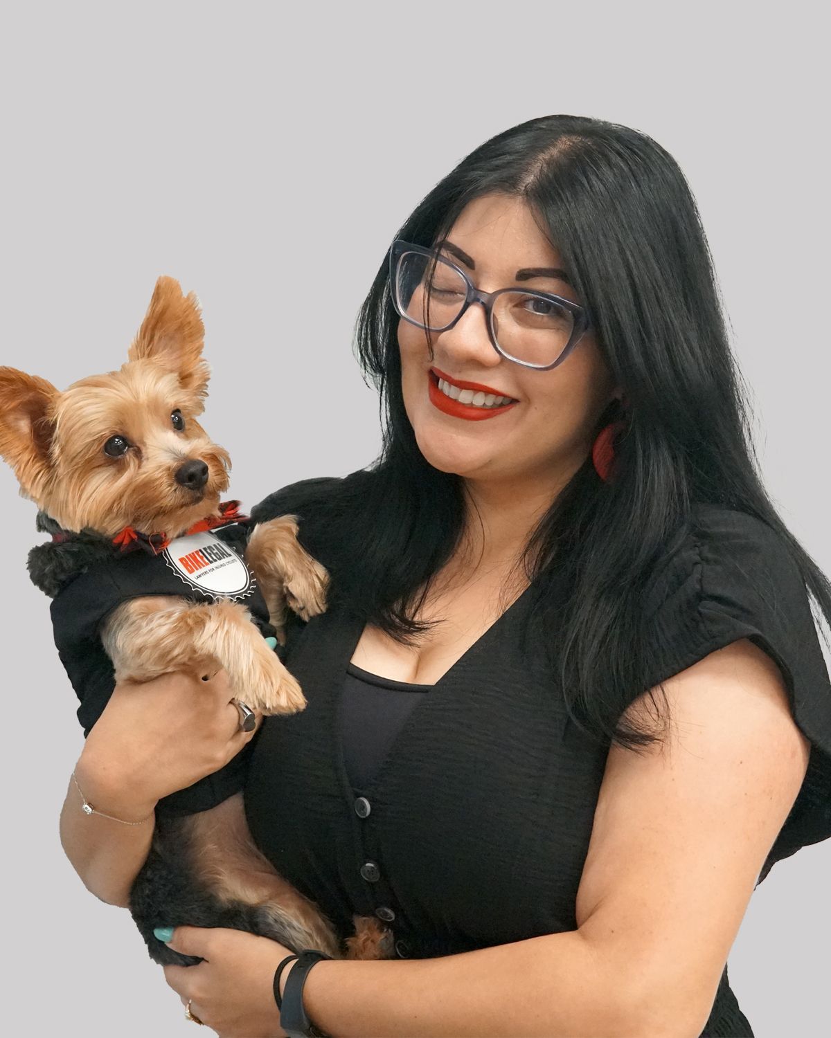 Jessica Ulloa, Senior Paralegal at Bike Legal, holding her dog Jack- bio photo