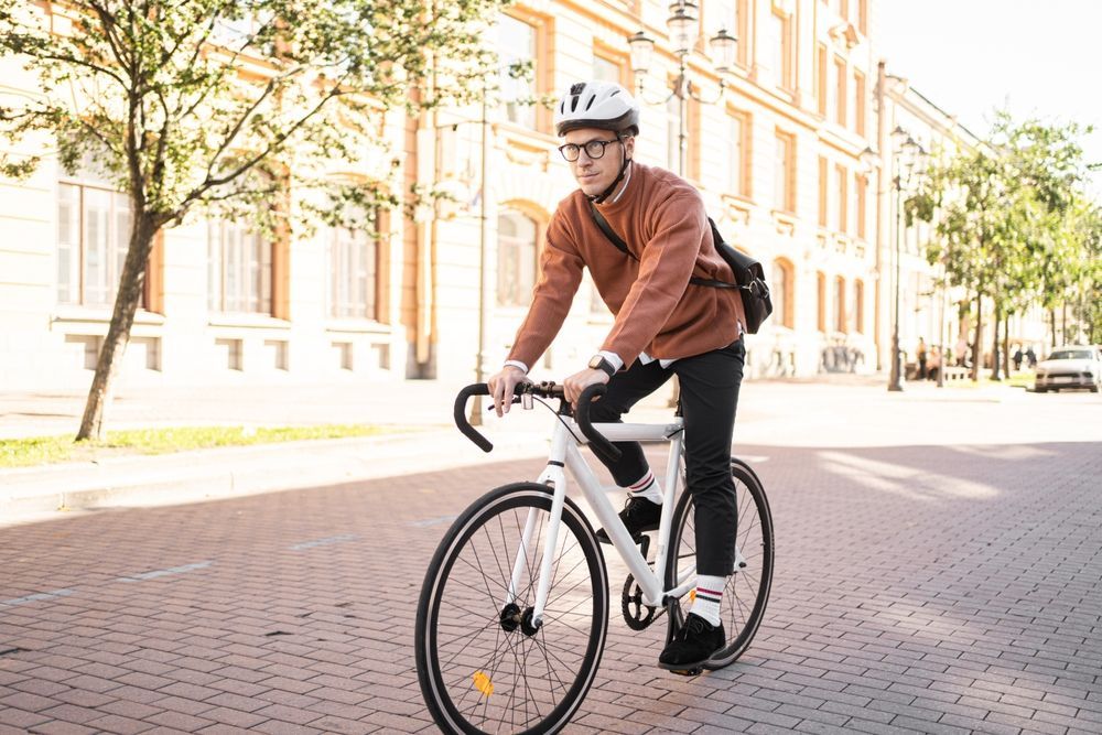 Businessman riding his bicycle to work on Bike to Work Day