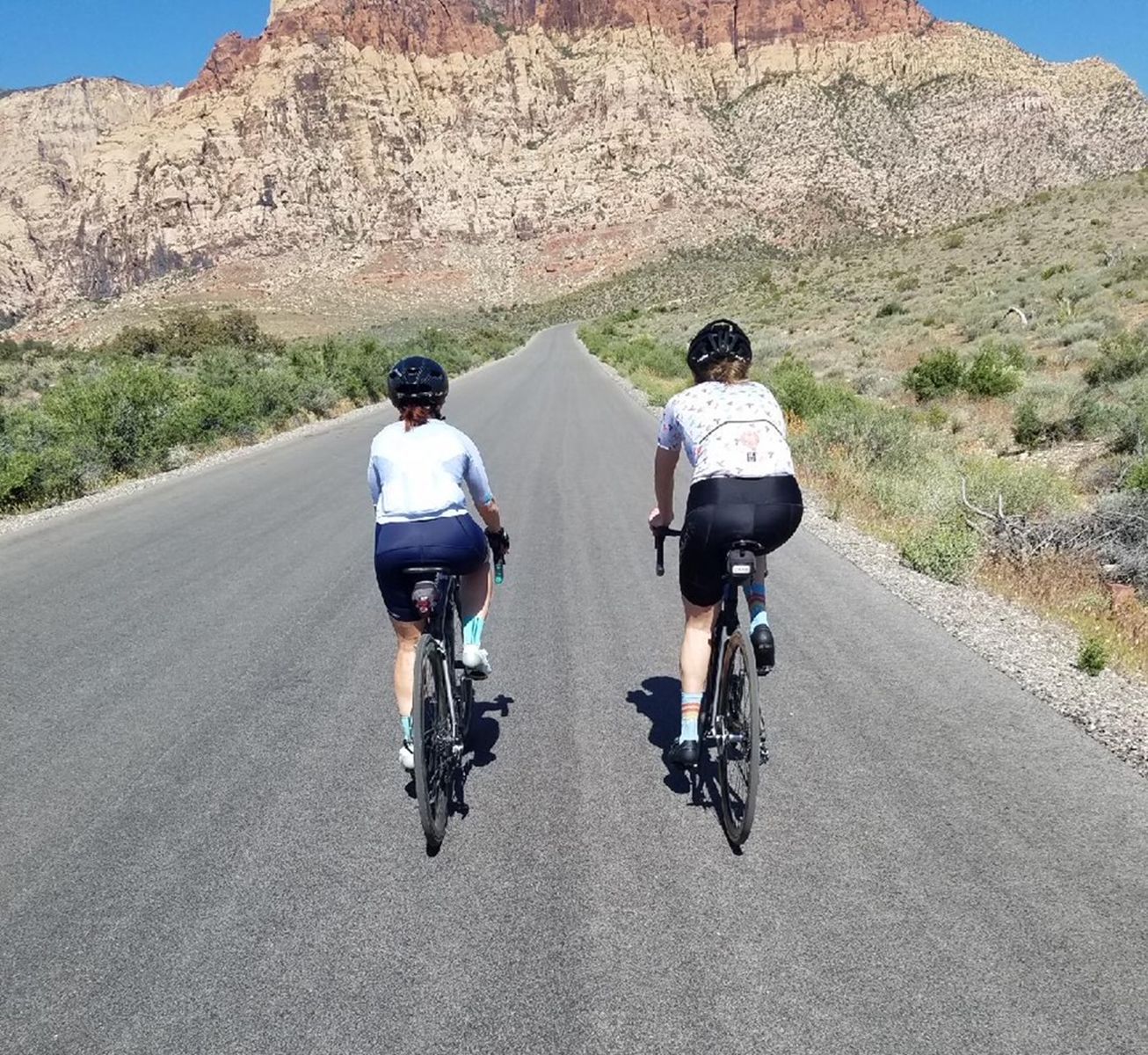 Two female cyclists on a road in Nevada