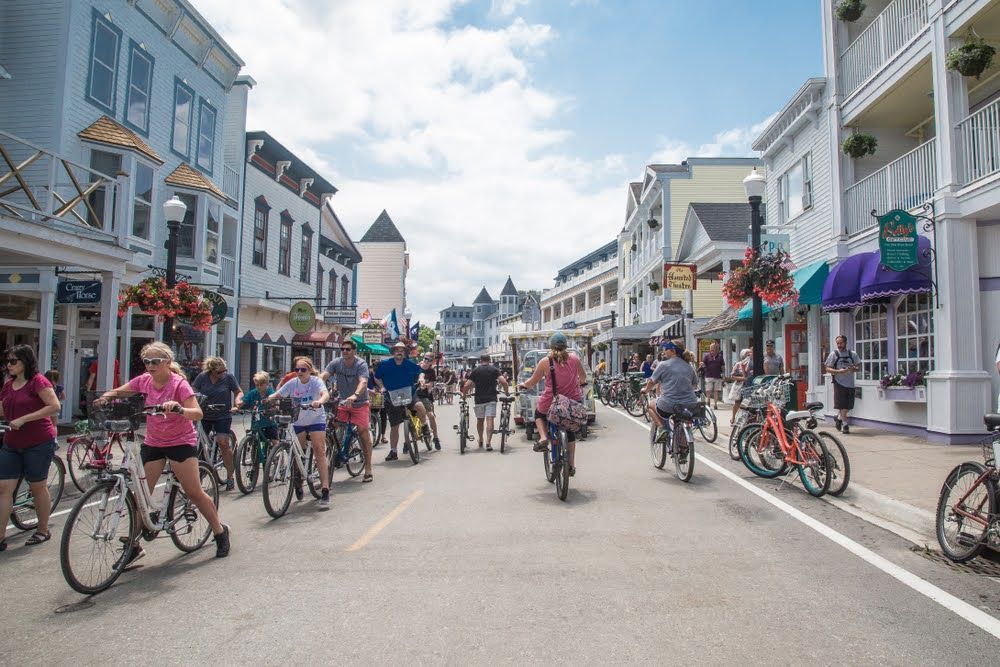 Bicycle riders fill the streets of Mackinac Island, Michigan