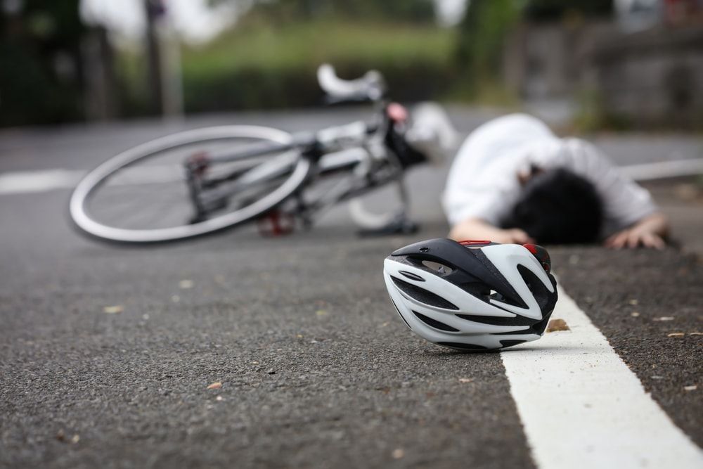 Los Angeles hit and run bicycle crash.  Bicyclist laying on a Los Angeles roadway unresponsive