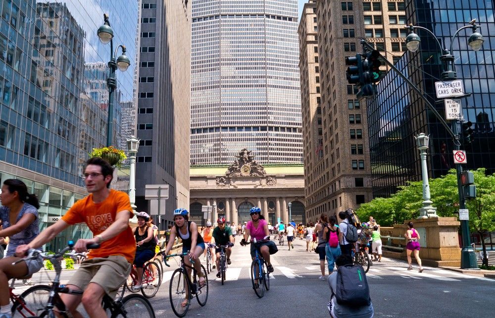 Busy NYC street filled with bicyclists and pedestrians
