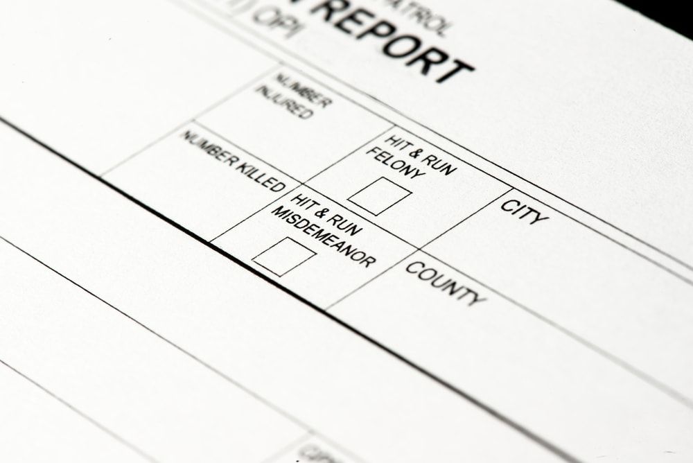 close up of traffic collision report hit and run check boxes Los Angeles