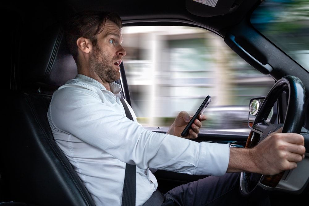 driver texting in shock about to crash