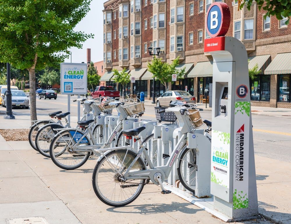 electric bicycle share program in Des Moines Iowa with bikes parked along the city street