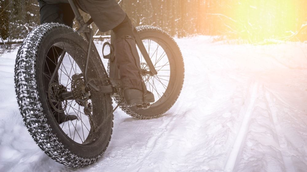 Fat bike winter bicycle on snow trail