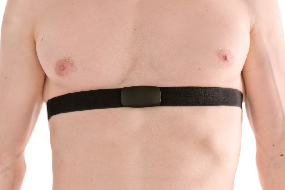 man wearing chest strap heart rate monitor