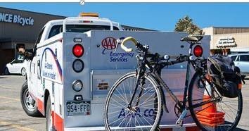 AAA tow truck towing bicycle