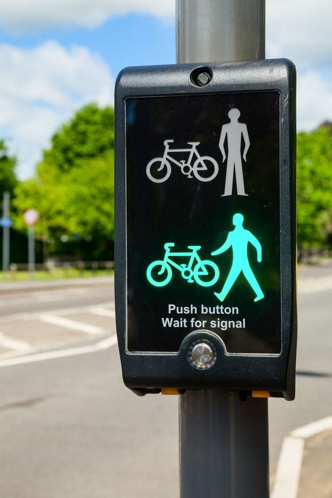 Traffic signal with bicycle and pedestrian illuminated green safe to cross