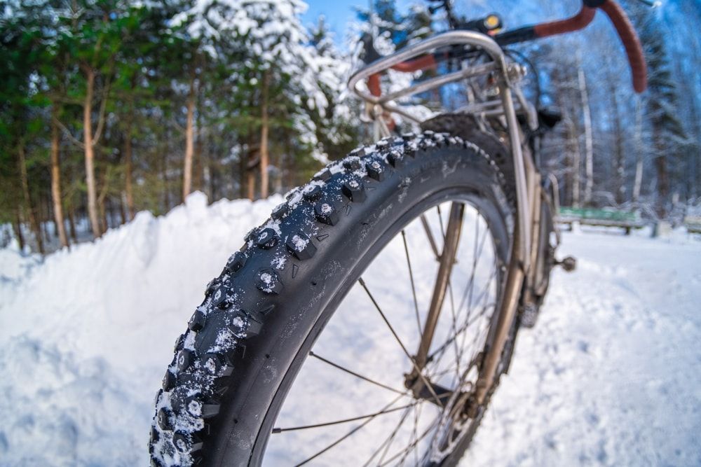 winter bike tire on a bike in the snow