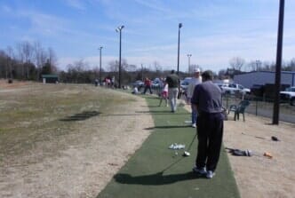 Golf lessons — Golf player pitching in Mooresville, NC