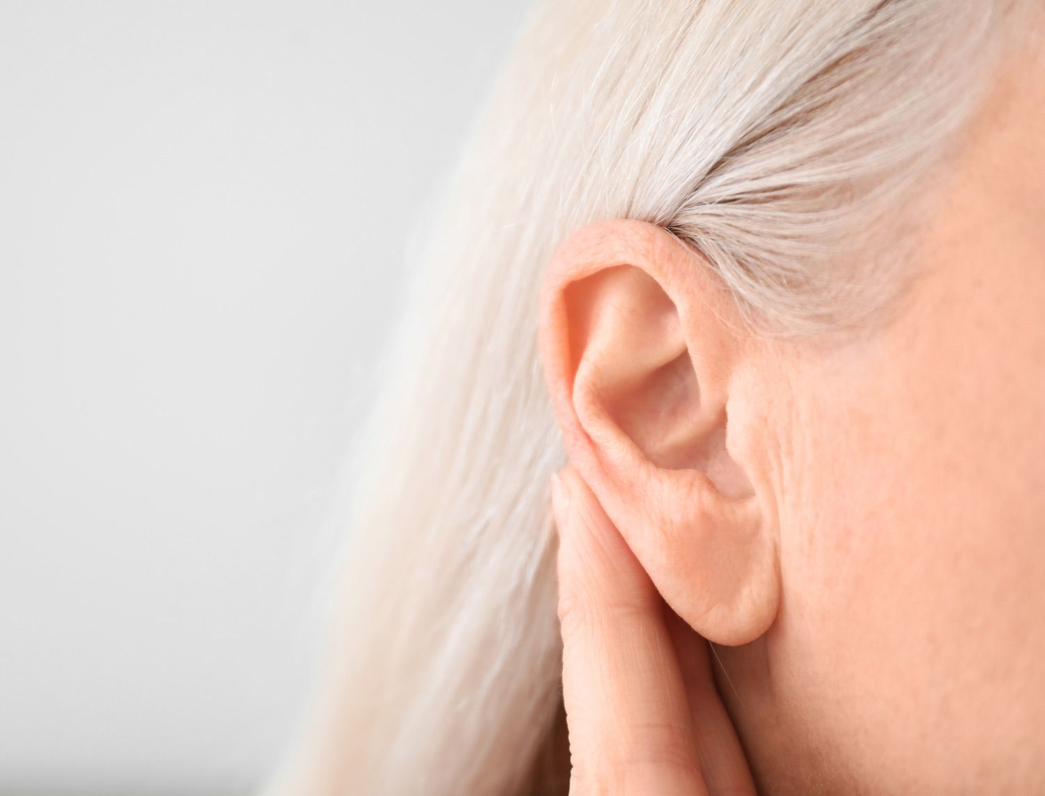 woman who received earlobe repair treatment