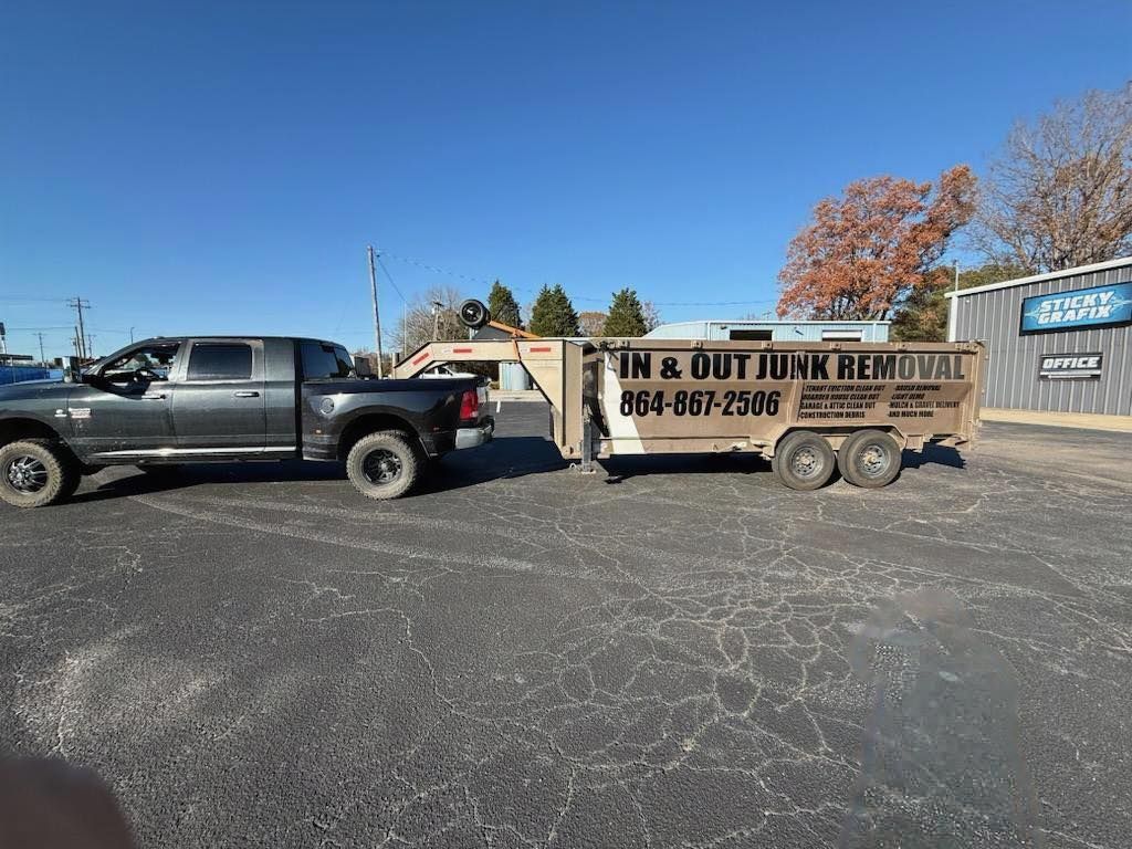 Dark pickup truck towing a trailer with