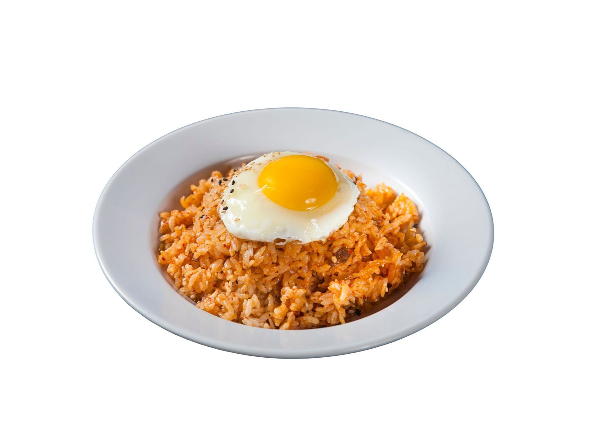 Chicken salad on a bed of greens, drizzled with sauce, served in a silver tray lined with paper.