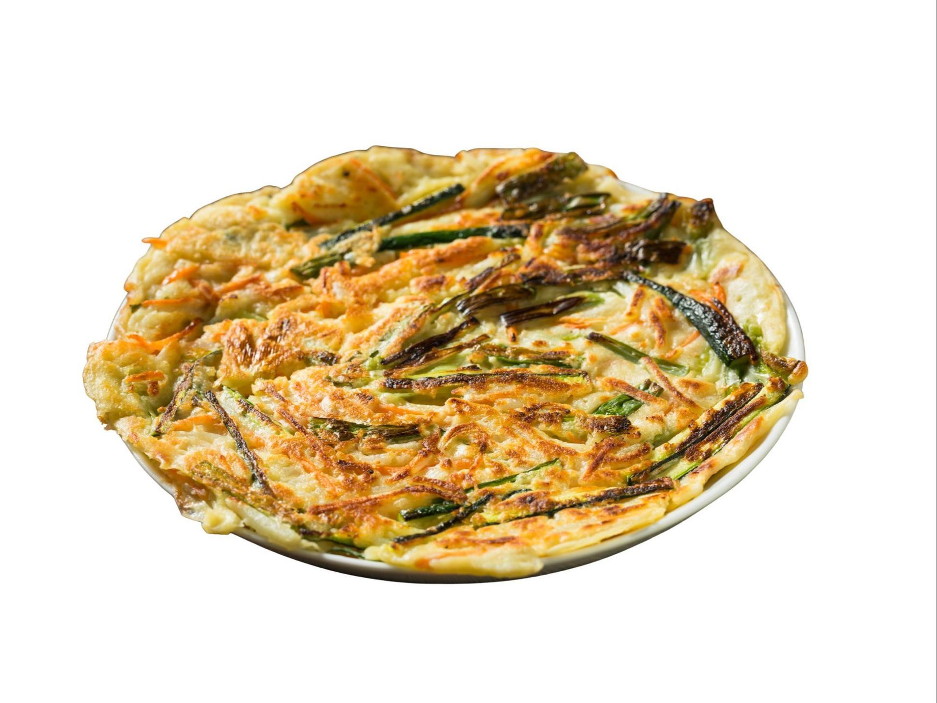 Grilled chicken salad with mixed greens, shredded cabbage, and drizzled sauce, in a silver tray.