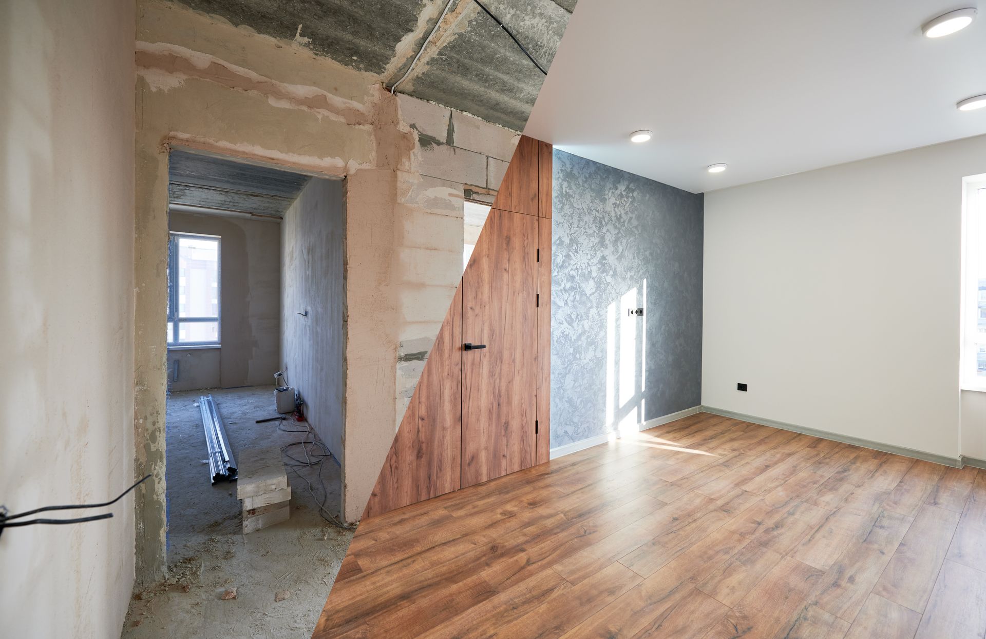 Renovated room with wood floor, exposed wall framing, doorway, and unfinished adjacent area