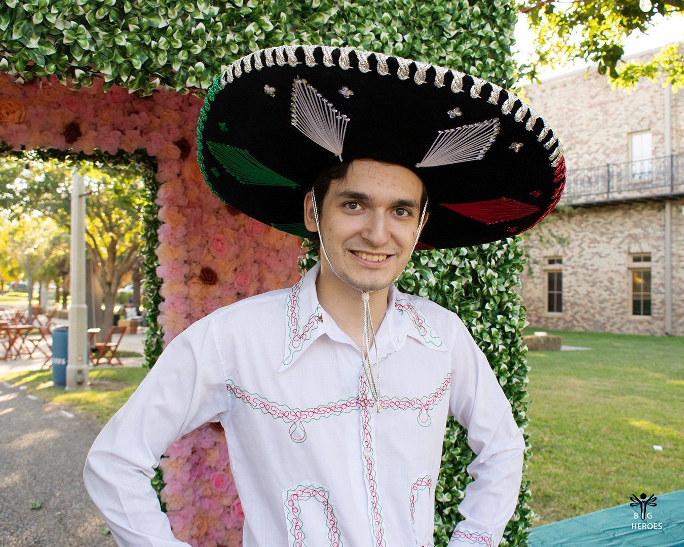 A man wearing a sombrero and a white shirt