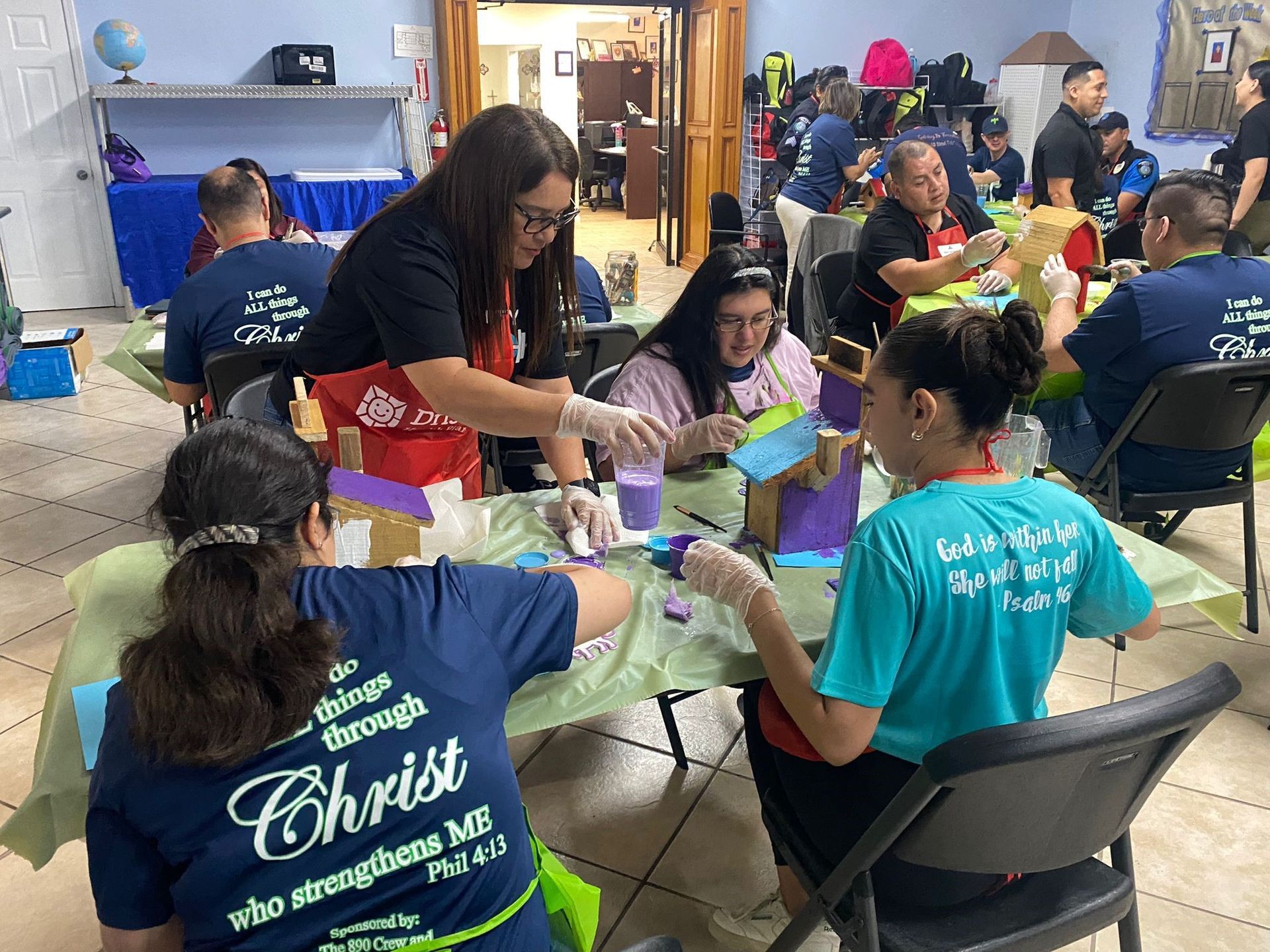 A group of people are sitting at tables in a room.