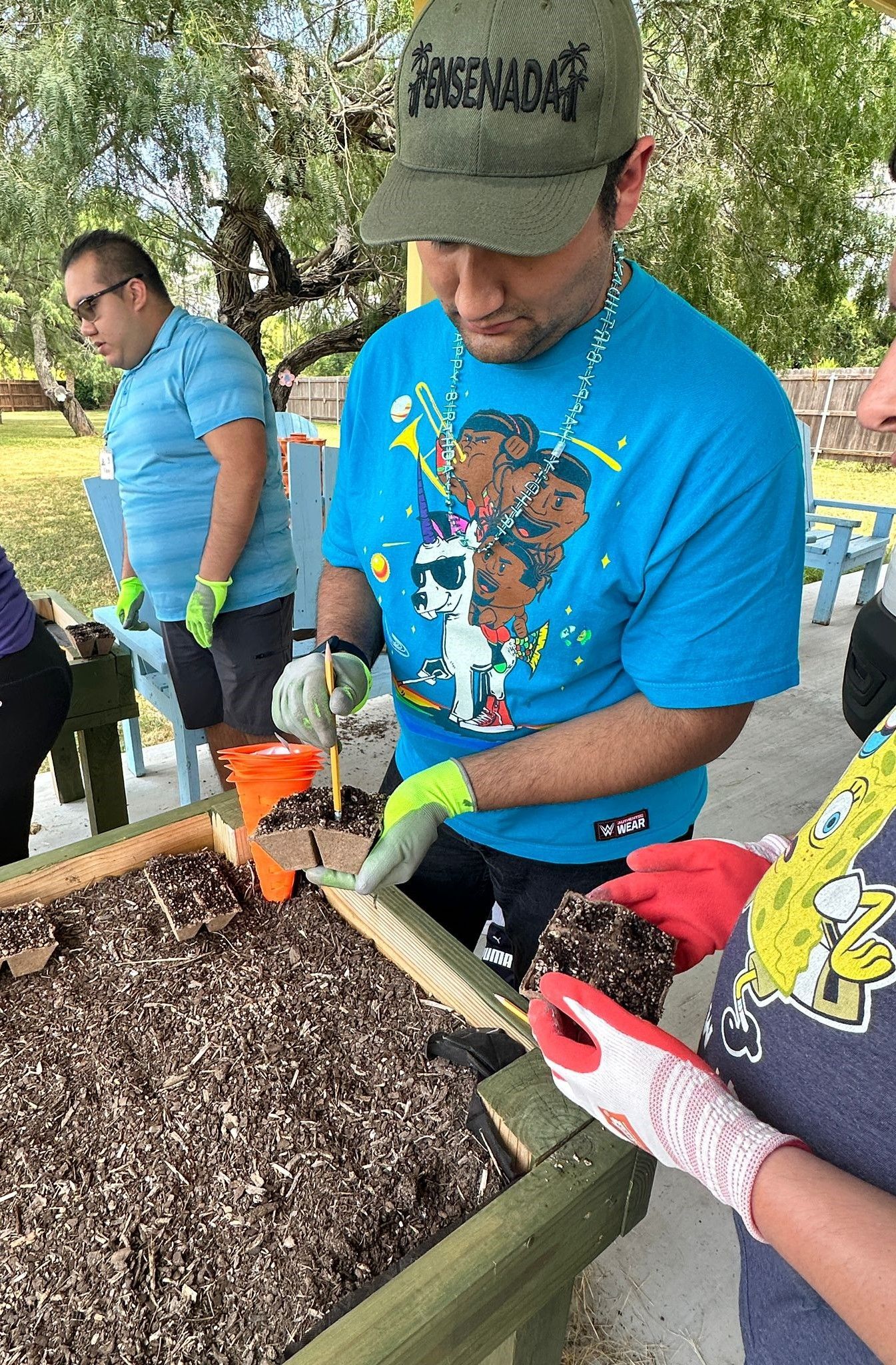A group of people are working in a garden.