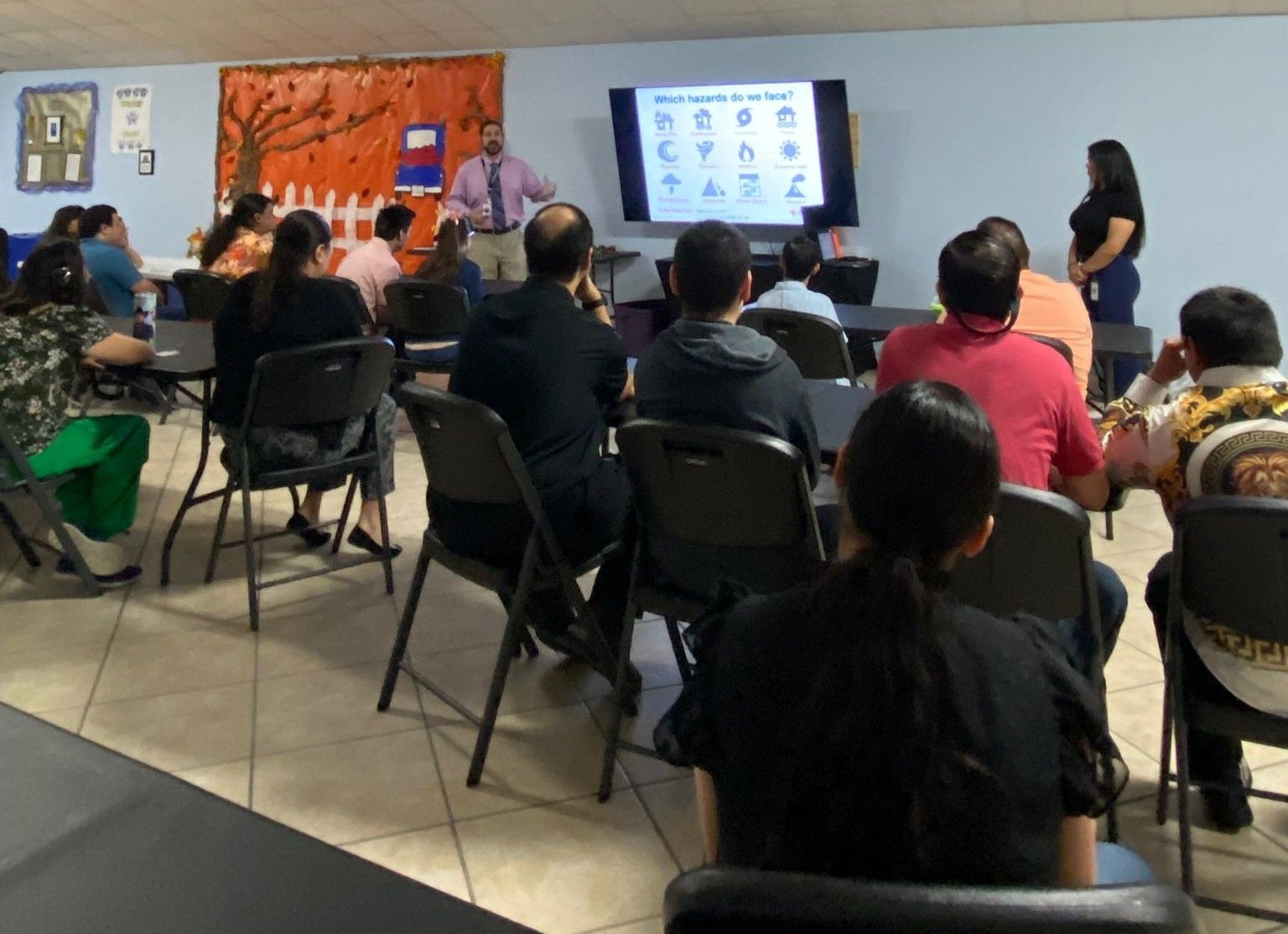 A man is giving a presentation to a group of people