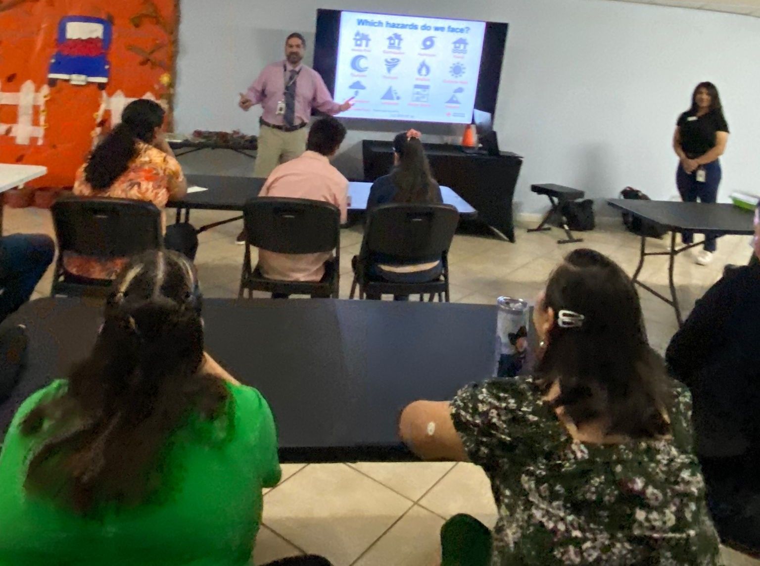 A man is giving a presentation to a group of people