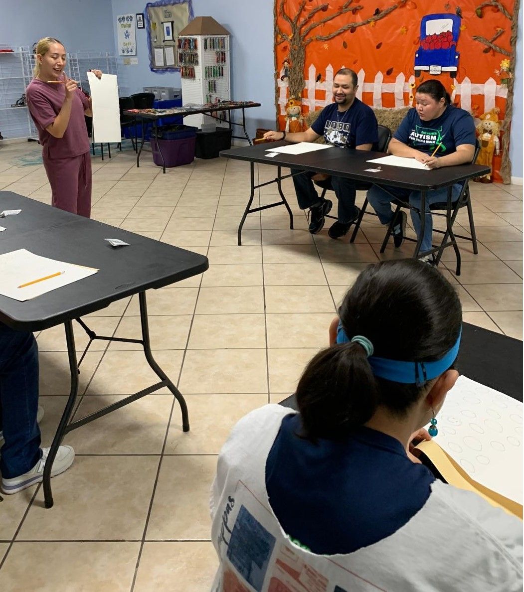 A group of people are sitting at tables in a room