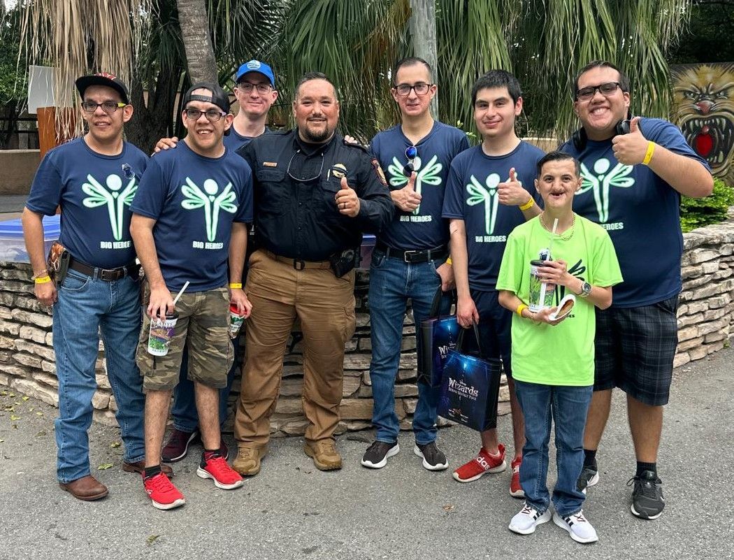 A group of men and a boy are posing for a picture.