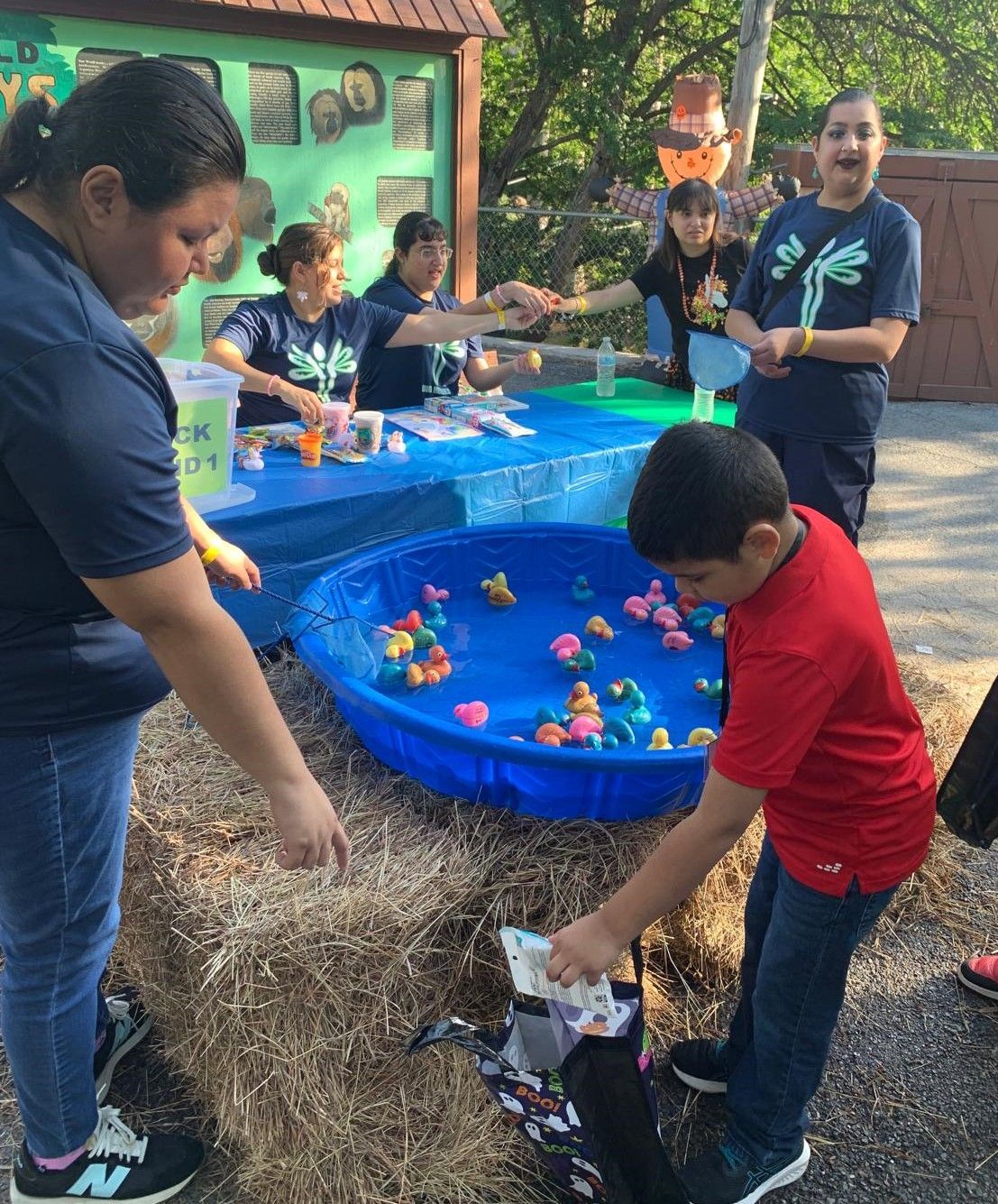A group of people are playing a game of duck fishing