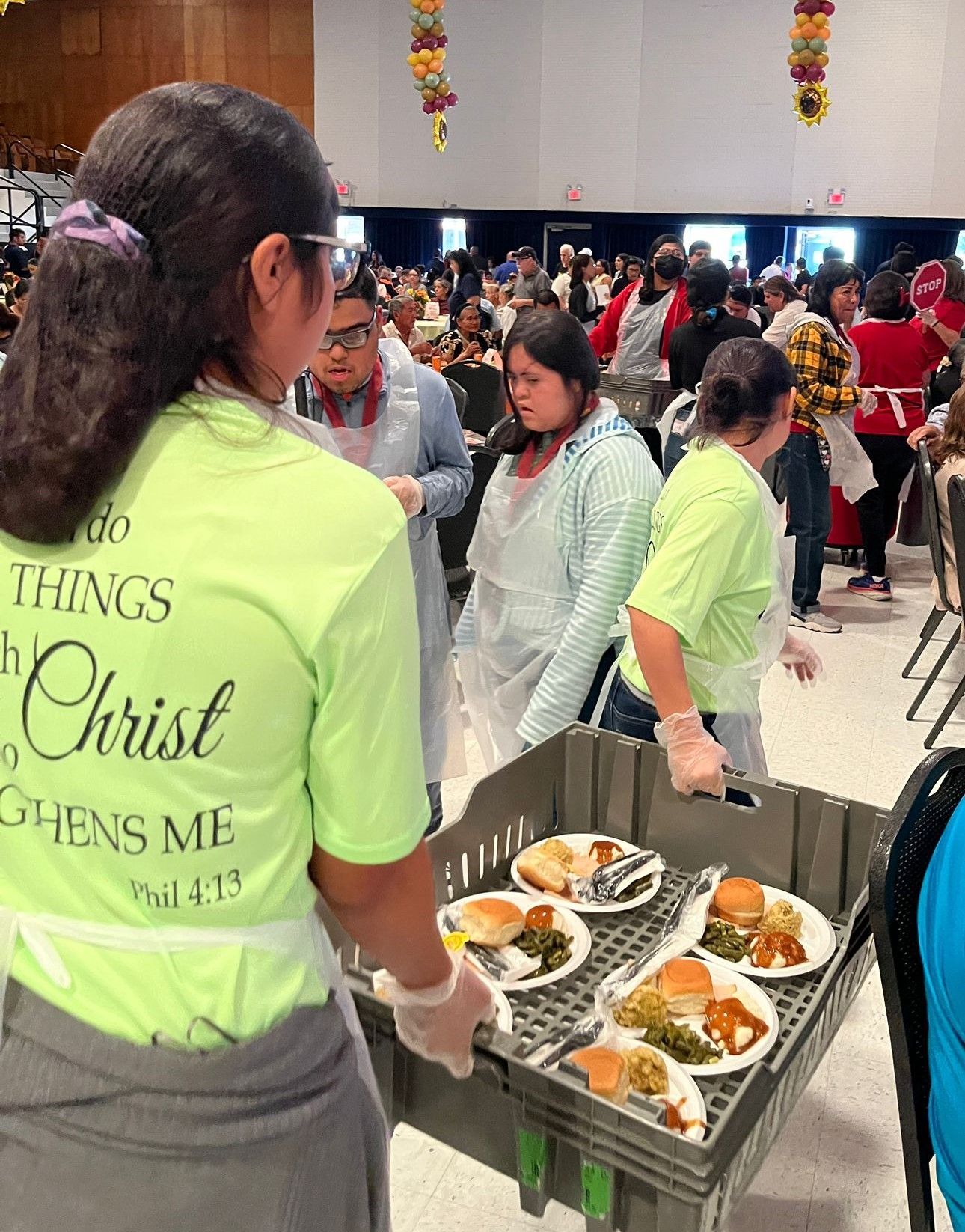 A woman wearing a shirt that says do things with christ