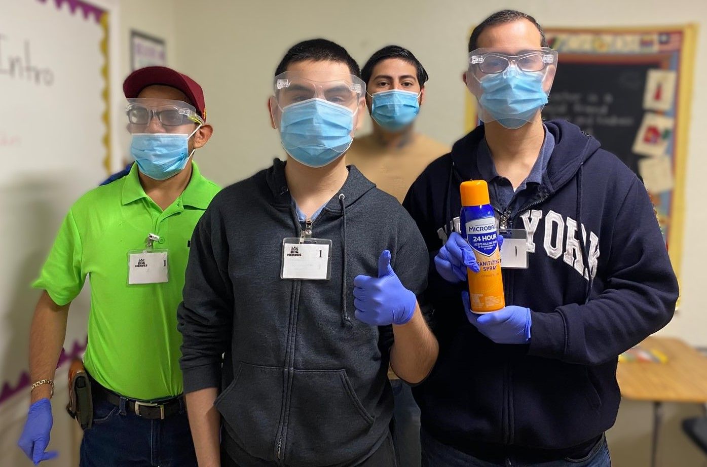 A group of men wearing face masks and goggles are standing next to each other.