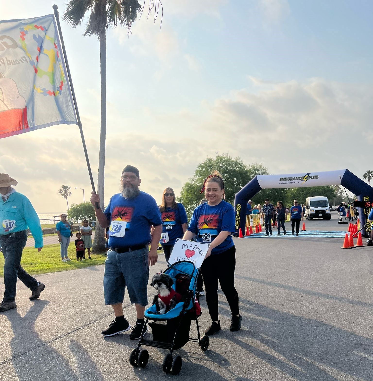 A woman pushing a stroller with a sign that says peace