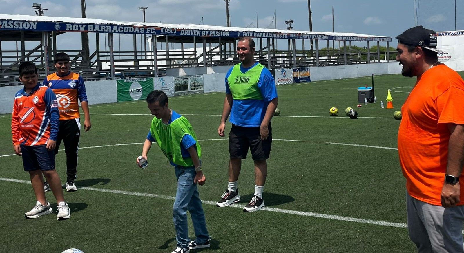 A group of men are playing soccer on a field.