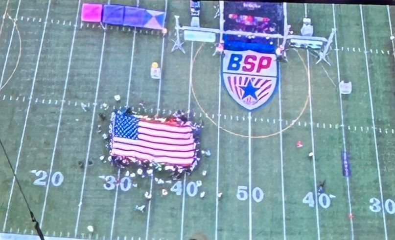 An aerial view of a football field with a bsp logo